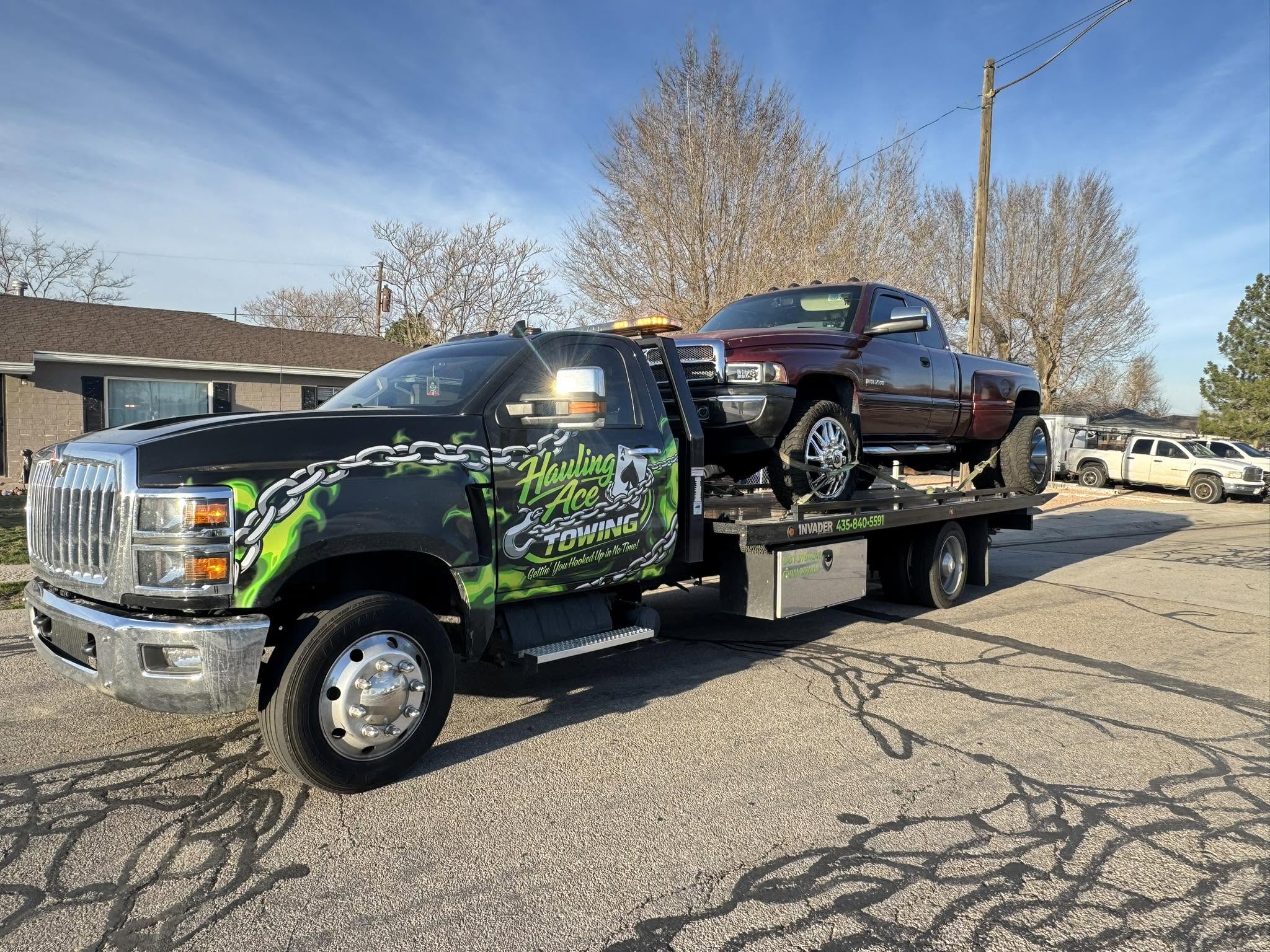 Hauling Ace Towing with a loaded flatbed near Lake Point