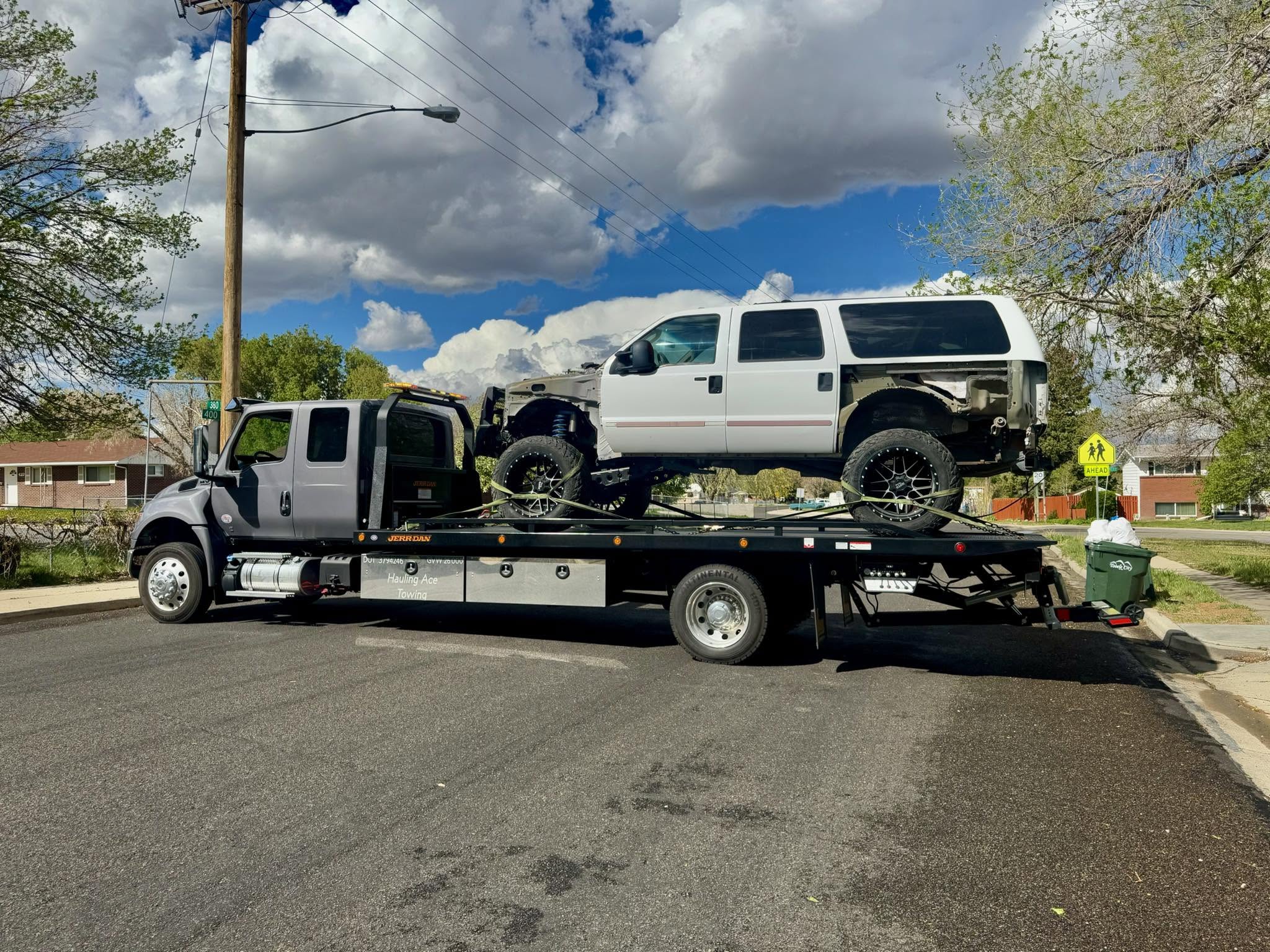 Hauling Ace Towing hauling a large vehicle near Erda, Utah
