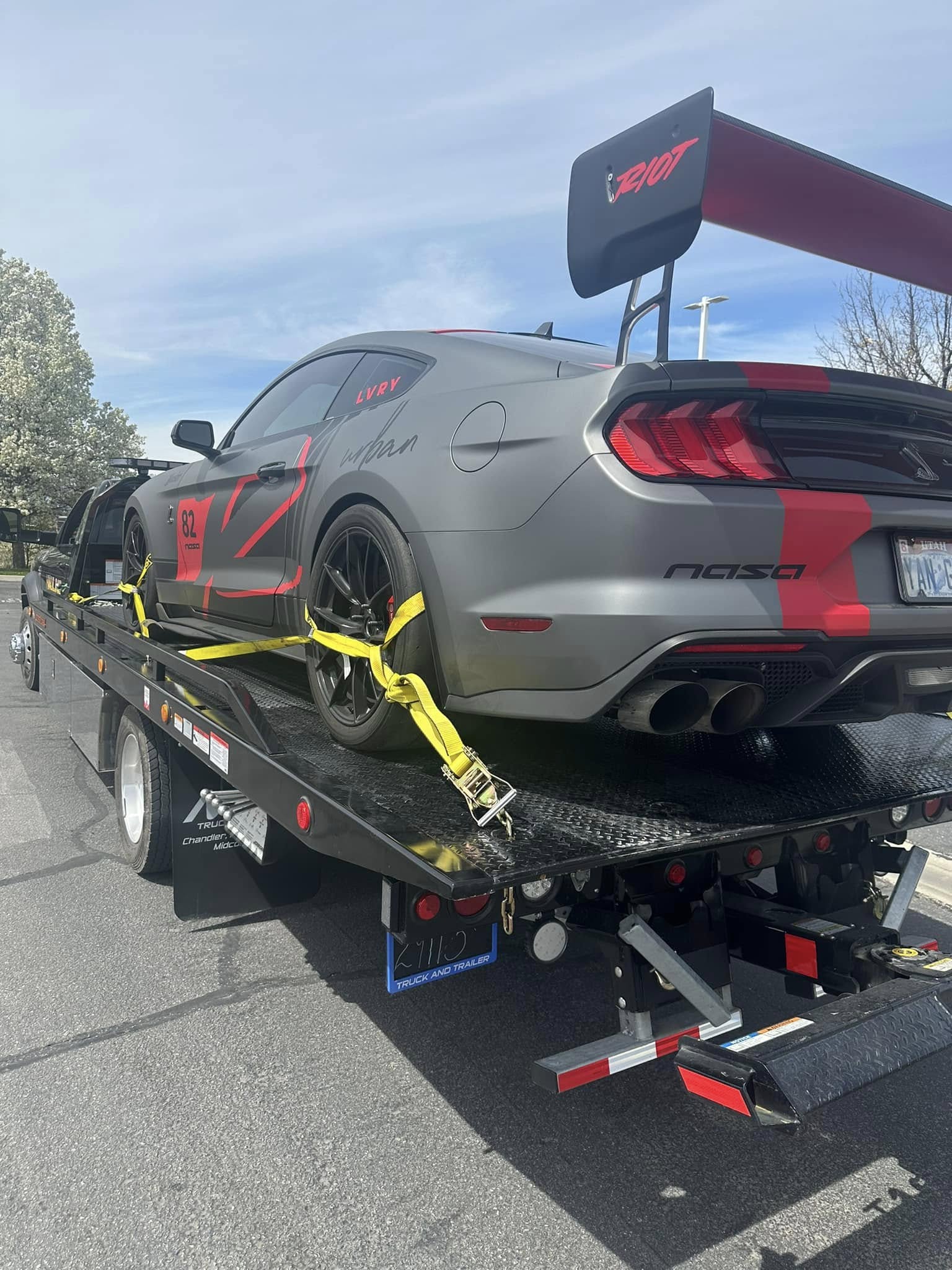 NASA class race Mustang strapped down on the Hauling Ace flatbed