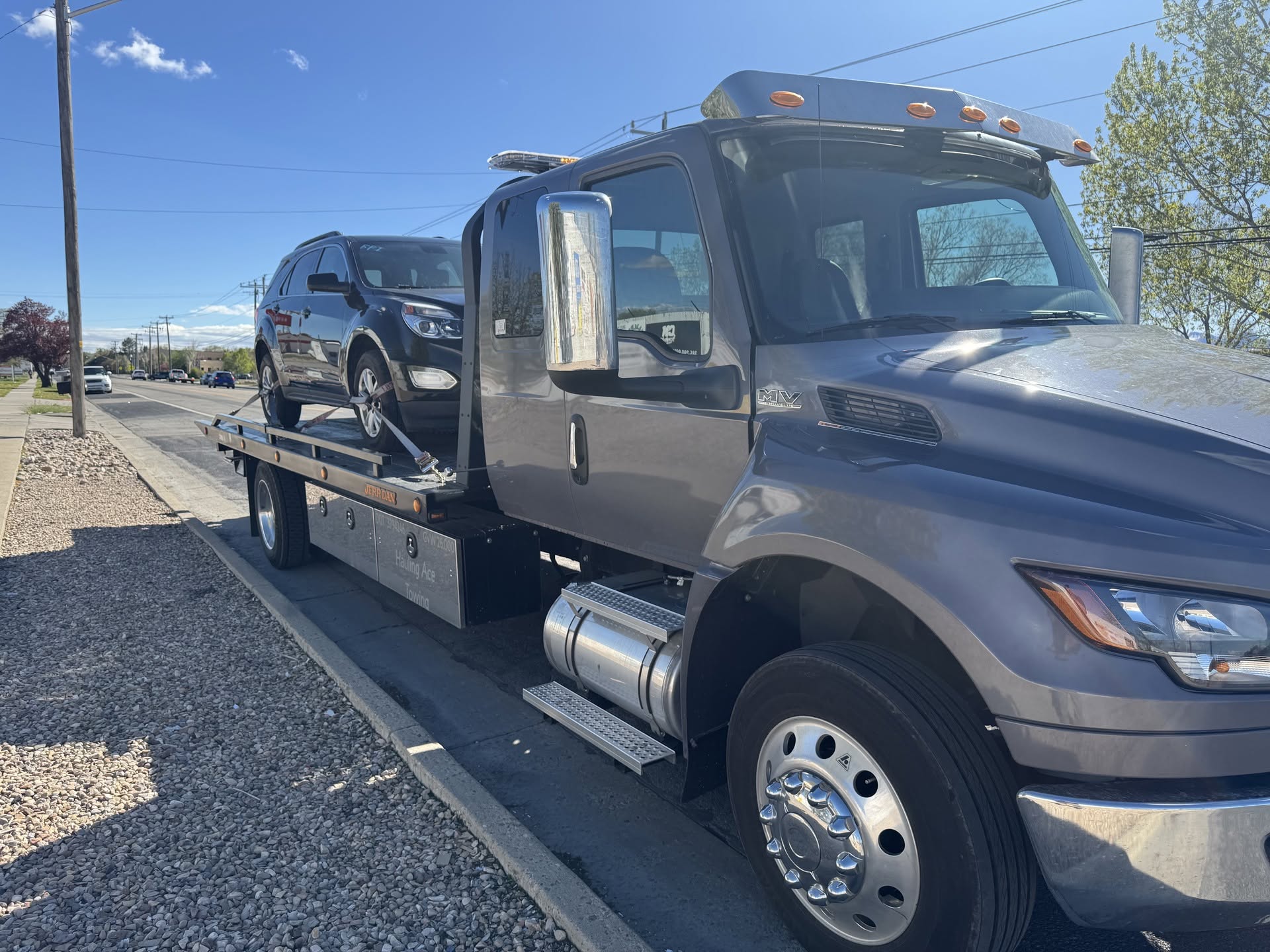 Hauling Ace Towing flatbed at the I-80 junction near Lake Point, Utah